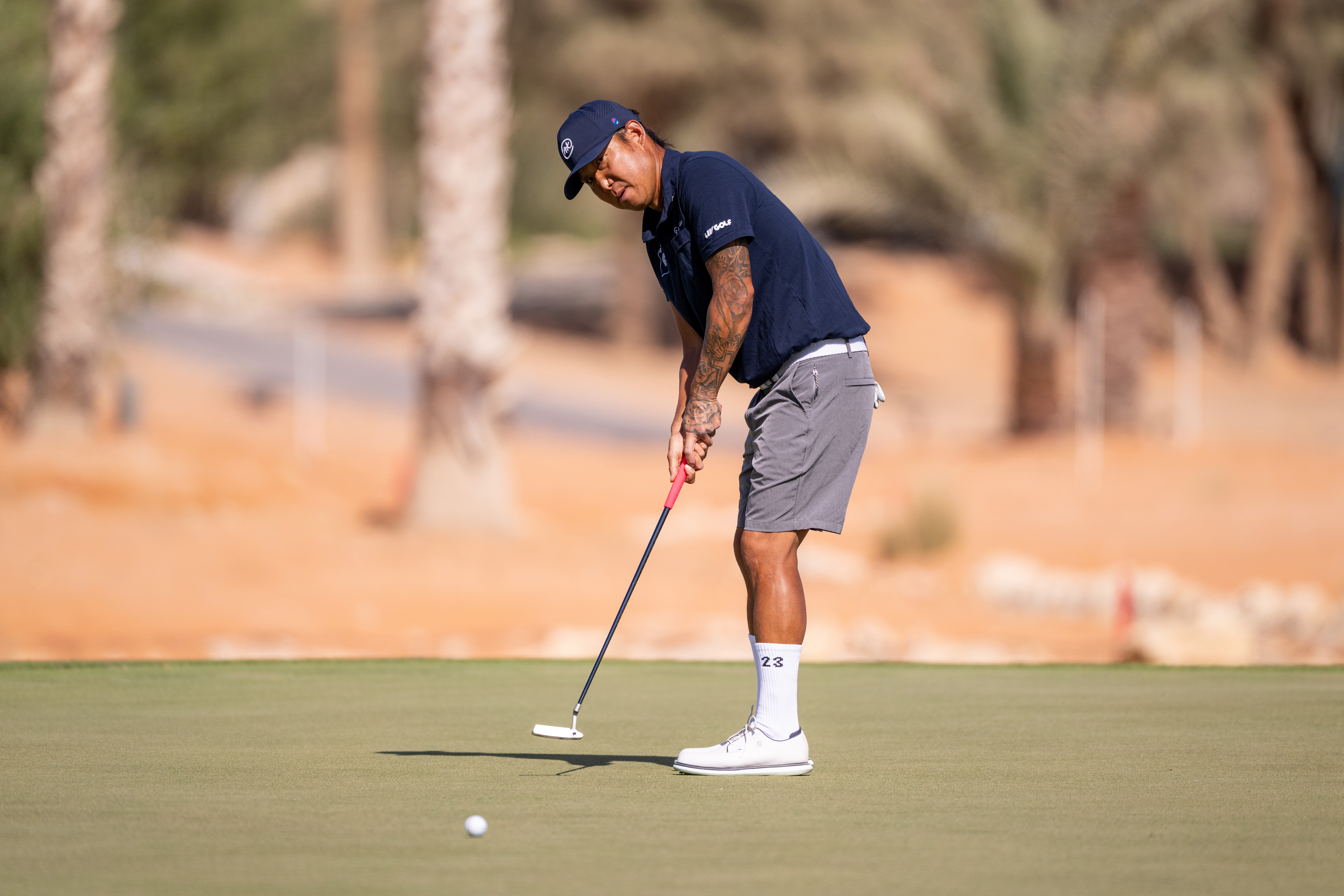 Anthony Kim hits a putt