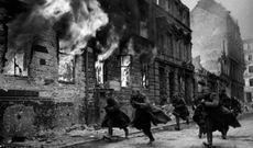 Russian assault troops charge down a street during the advance through Poland