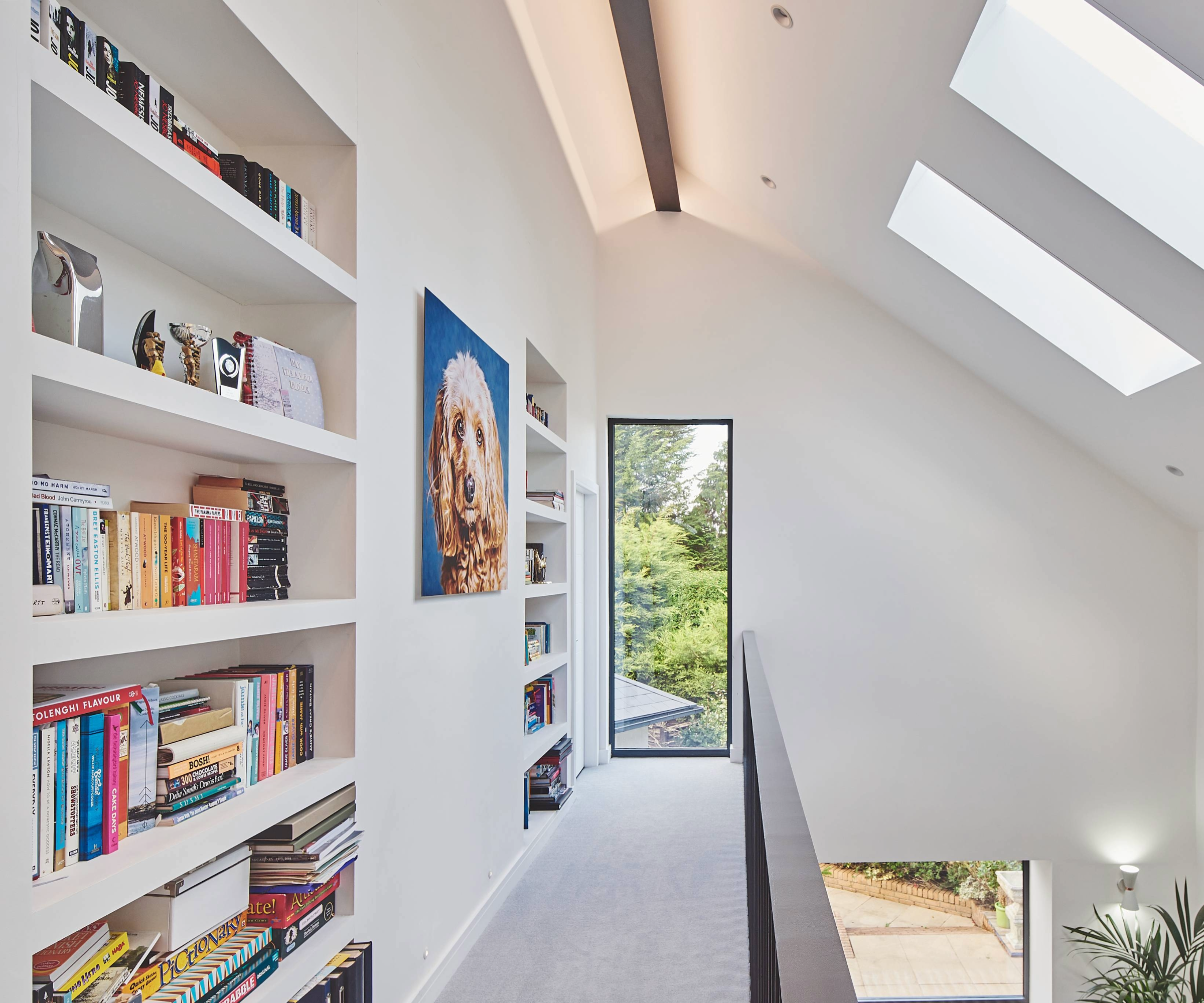 Built in storage idea with two built in shelves with books on them
