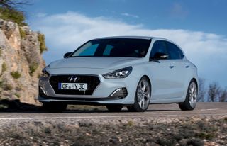The front of the Hyundai i30 Fastback on the road