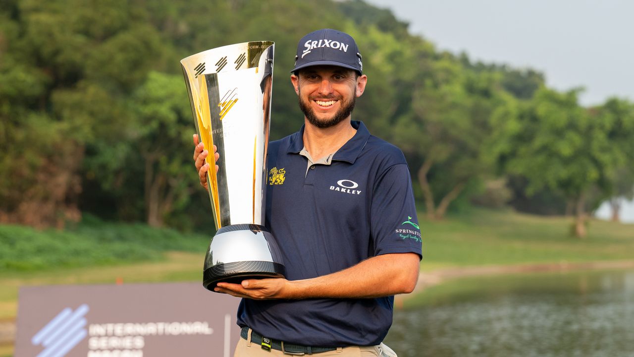 John Catlin poses with the 2024 International Series Macau trophy