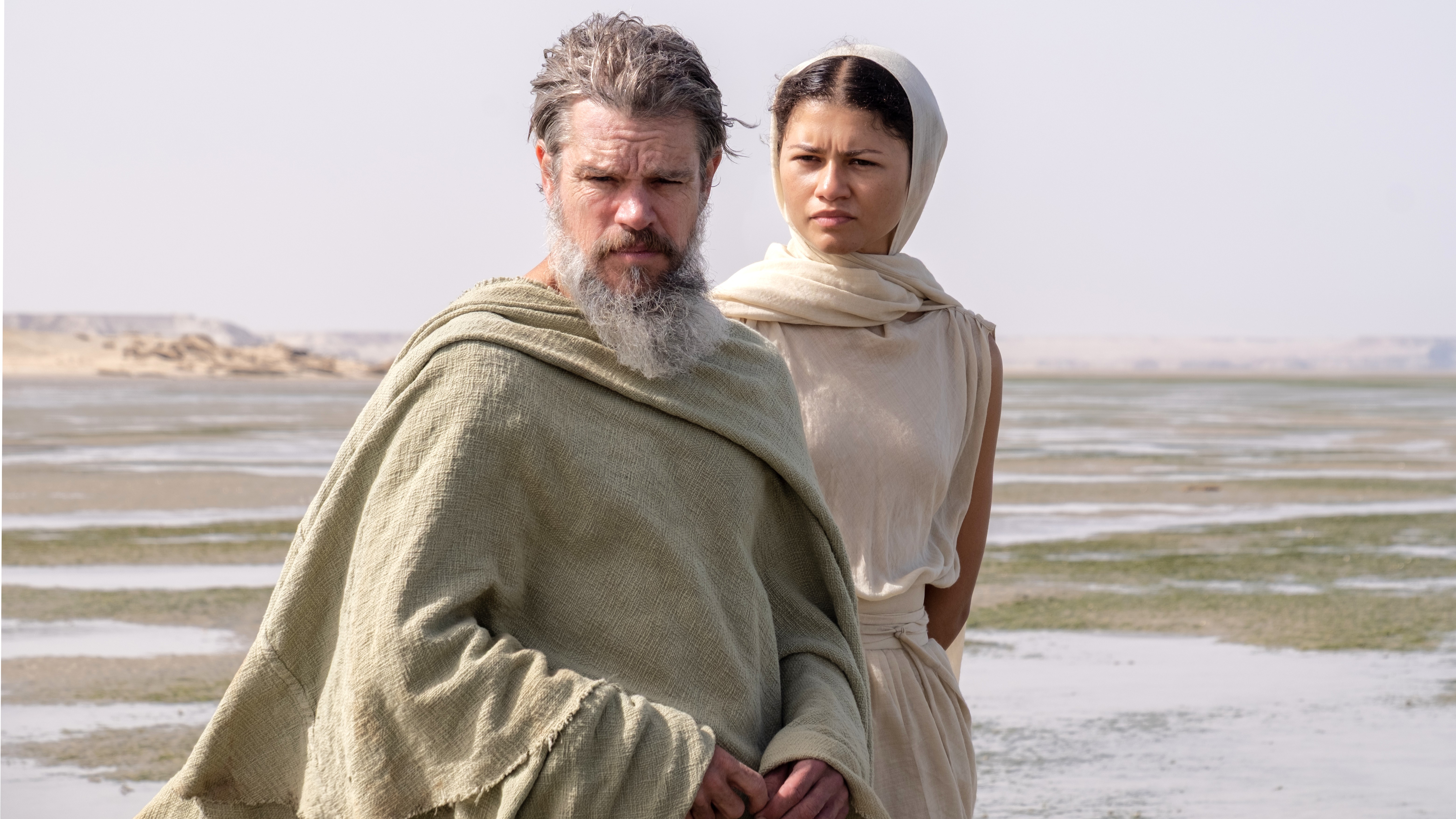 (L-R) Matt Damon as Odysseus and Zendaya as Athena in "The Odyssey" (2026)