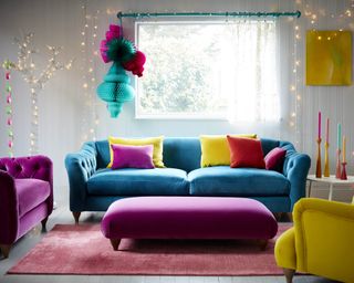 A living room with bold and bright velvet sofa furniture with assortment of velvet scatter cushions