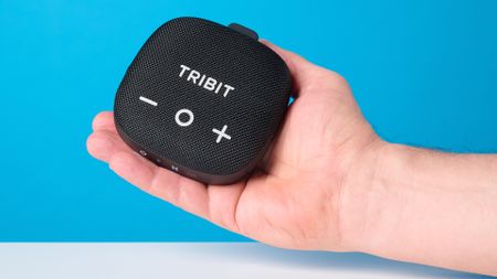 Tribit StormBox Micro 3 in black photographed in front of a blue background