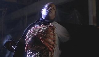 Candyman exposing his rotting chest