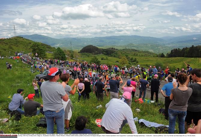 Fans watch the Giro d'Italia pass