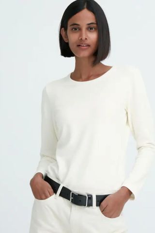 cold weather clothing - woman wearing cream long sleeved top
