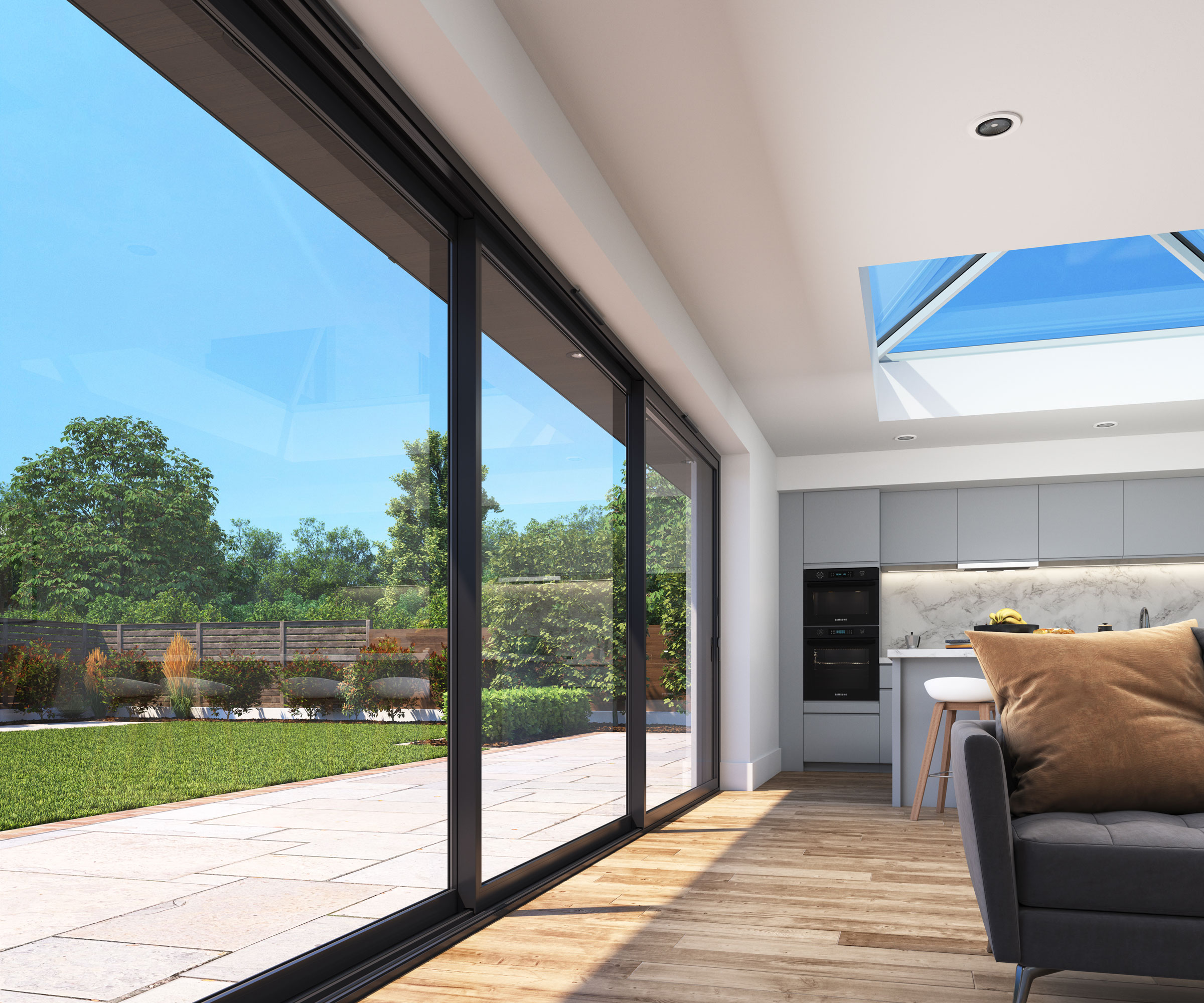 Large contemporary living space with wooden floor with rooflight and large expanse of sliding doors