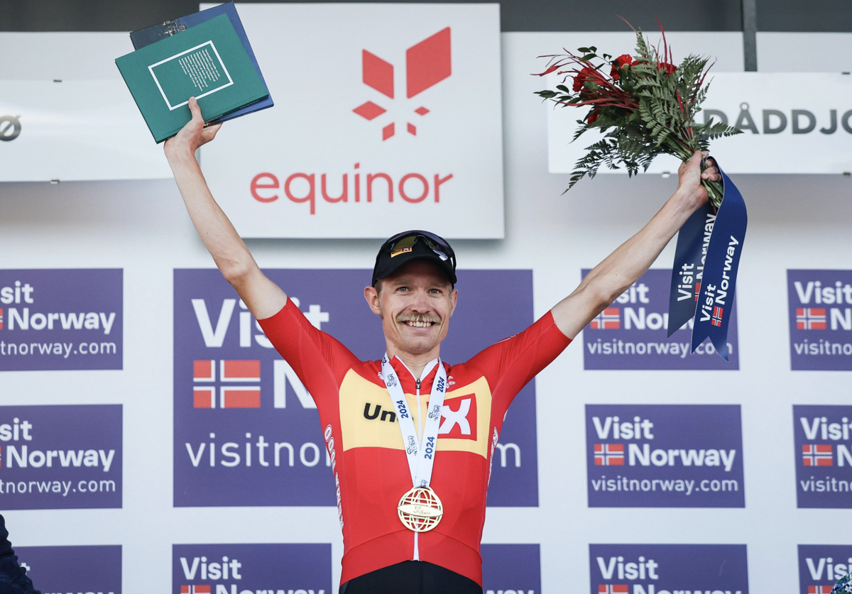 Magnus Cort celebrates on podium as Visit Norway stage 4 winner and secures GC title at Arctic Race of Norway 