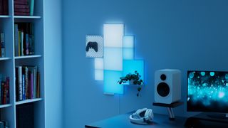 Plant and game controller displayed with Nanoleaf Blocks smart lights