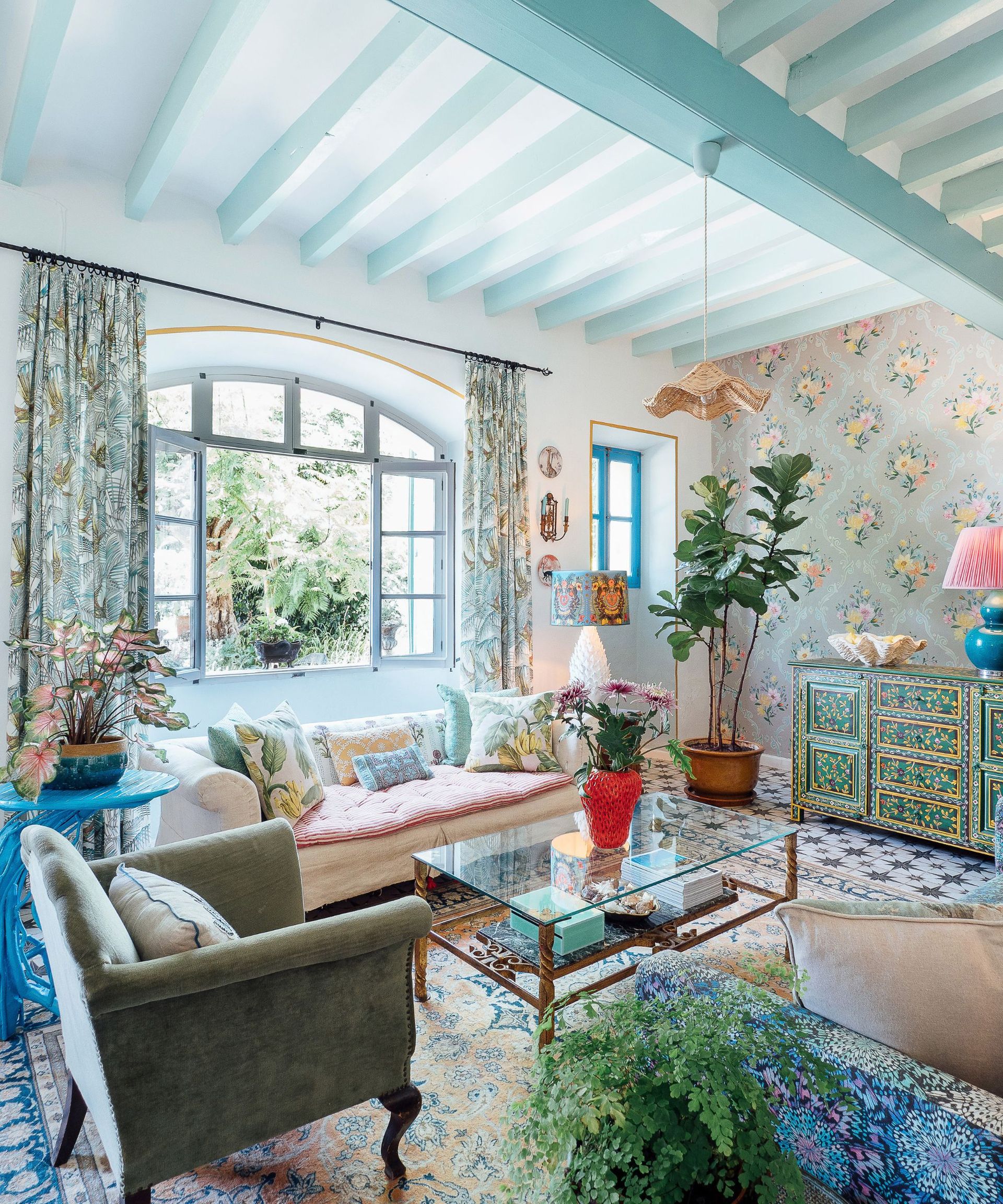 Transitional living room with blue wallpaper