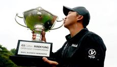 Hongtaek Kim kisses the trophy