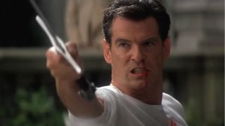 A bloody Pierce Brosnan angrily raises a sword in Die Another Day.