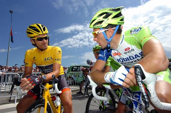 Tour de France leader Fabian Cancellara chats with Ivan Basso in Rouen prior to the start of stage 5.