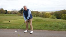 Jezz Ellwood playing a ball from a cart path