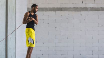 A man swinging a skipping rope