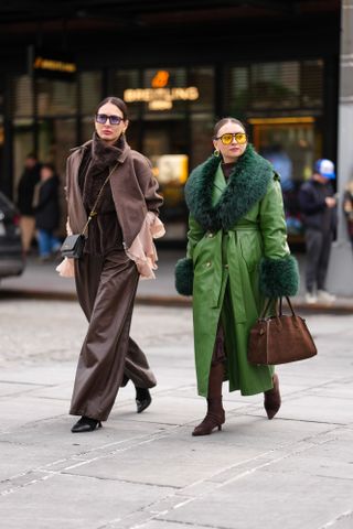 two women at new york fashion week carrying the row's margaux bag