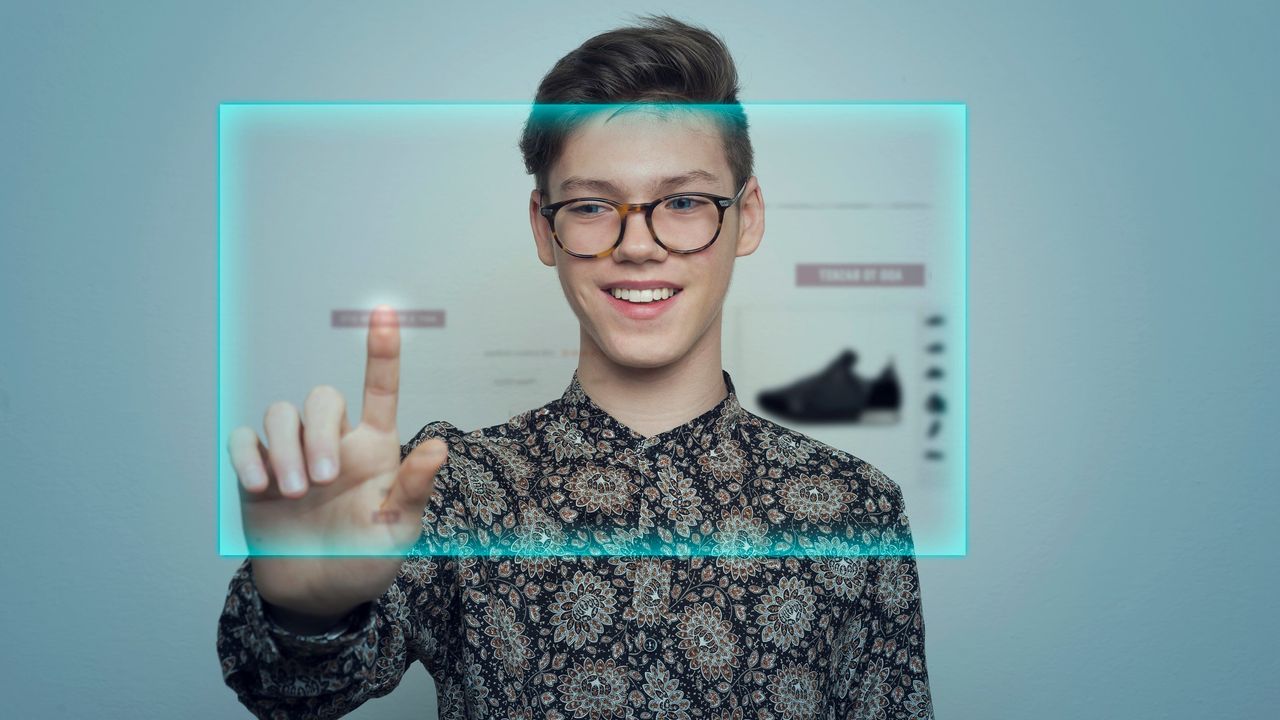 Young man shopping via augmented reality interface