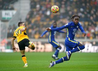 Wolves' Daniel Podence and Chelsea’s Trevoh Chalobah, right, battle for the ball