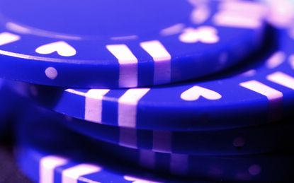 Closeup on a stack of blue poker chips