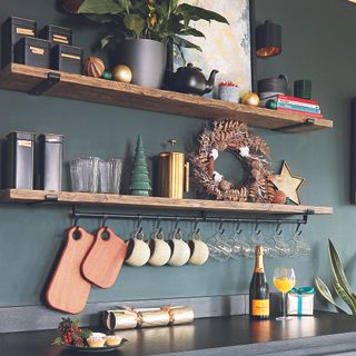 Kitchen with wooden open shelving with Christmas decor