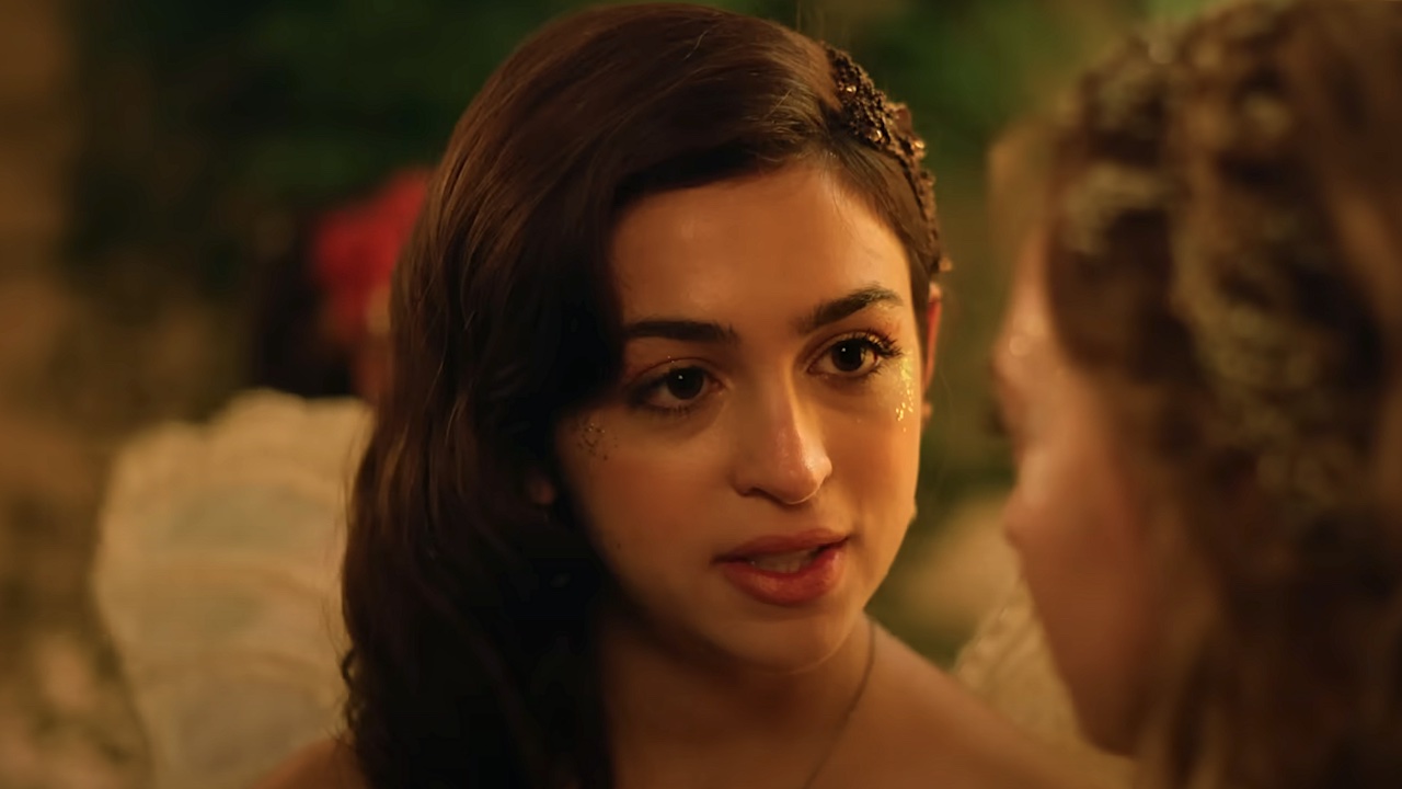 Josie Totah's Mabel wearing wings in The Buccaneers