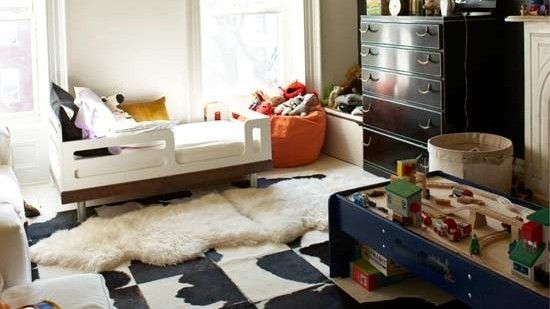 bedroom with bed and colourful cushions