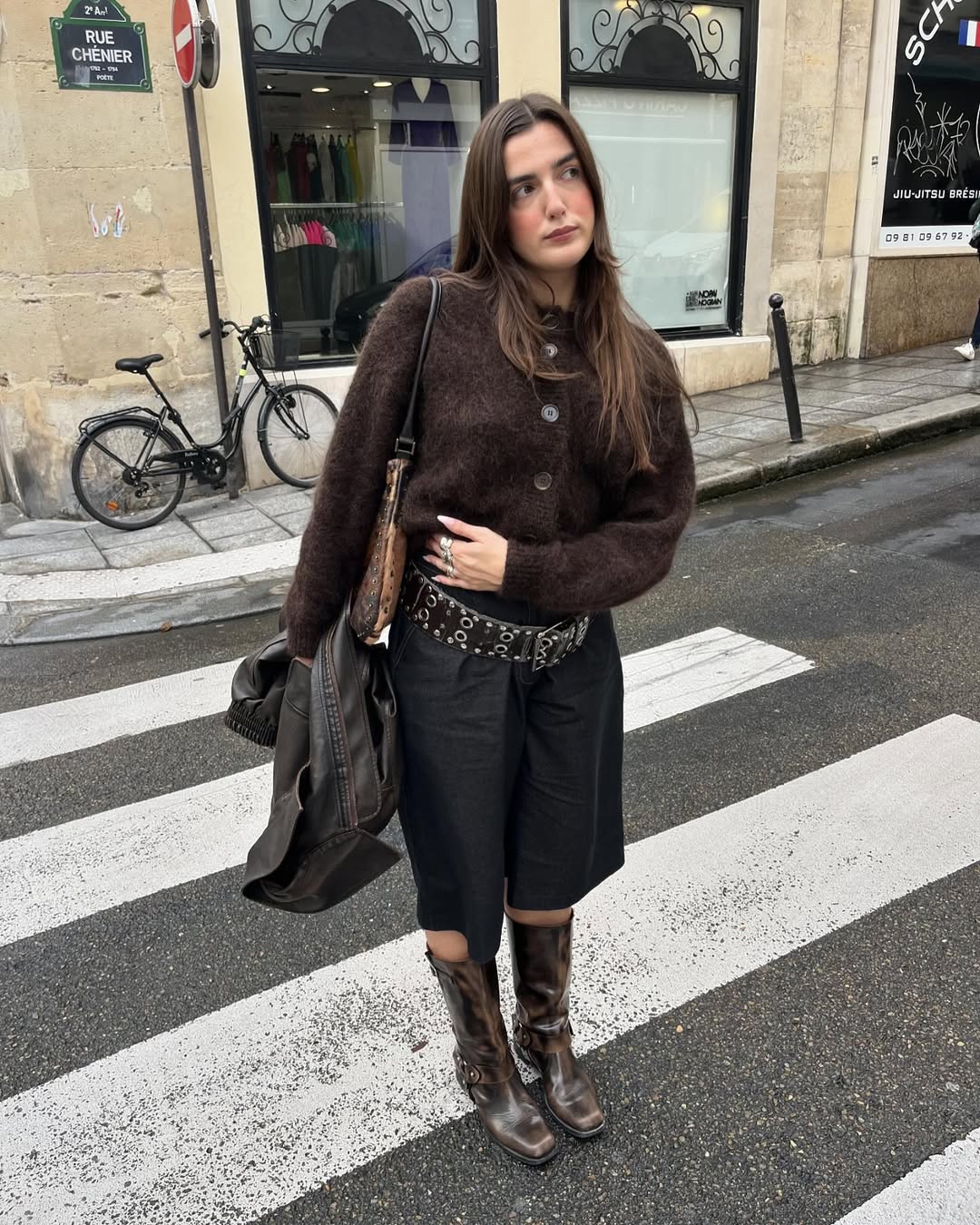 woman wearing bermuda shorts with boots outfit 2025