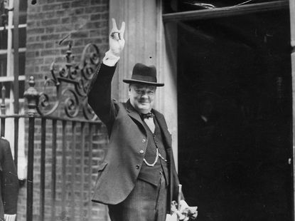 Prime Minister Winston Churchill outside 10 Downing Street, gesturing his famous 'V for Victory' hand signal, June 1943.
