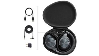 Technics EAH-A800 headphones inside carry case with accessories on white background