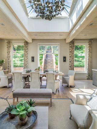 Beige open plan living space with glazed ceiling