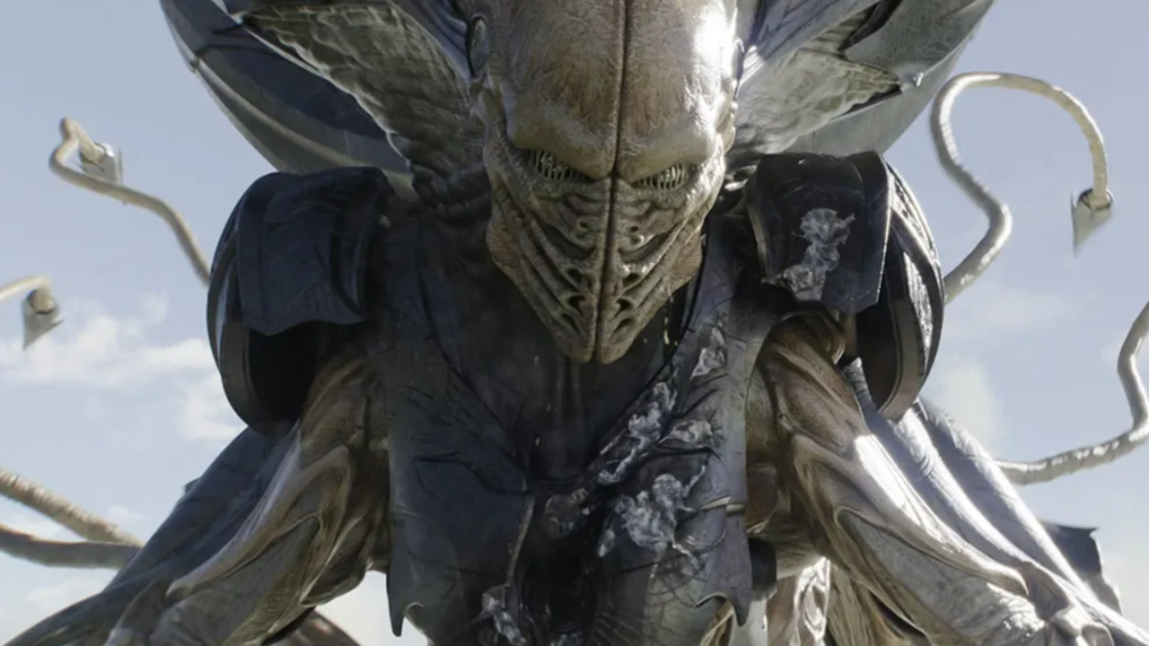 scene from a movie showing a closeup of a multi-tentacled alien with greenish skin
