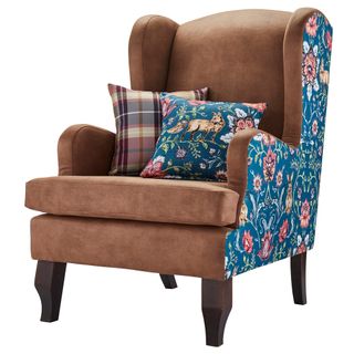 brown coloured arm chair with cushions