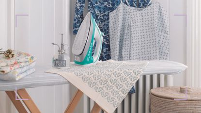 white laundry room with ironing board and iron to support a guide for how to clean an iron