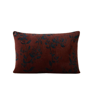 A red floral patterned cushion