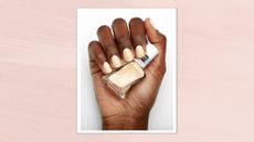 A close-up of a hand with holding a bottle of essie Gel Couture Gel-Like Nail Polish in shade Atelier At The Bay and with the colour applied to the fingernails/ featured in a pink watercolour paint-style template