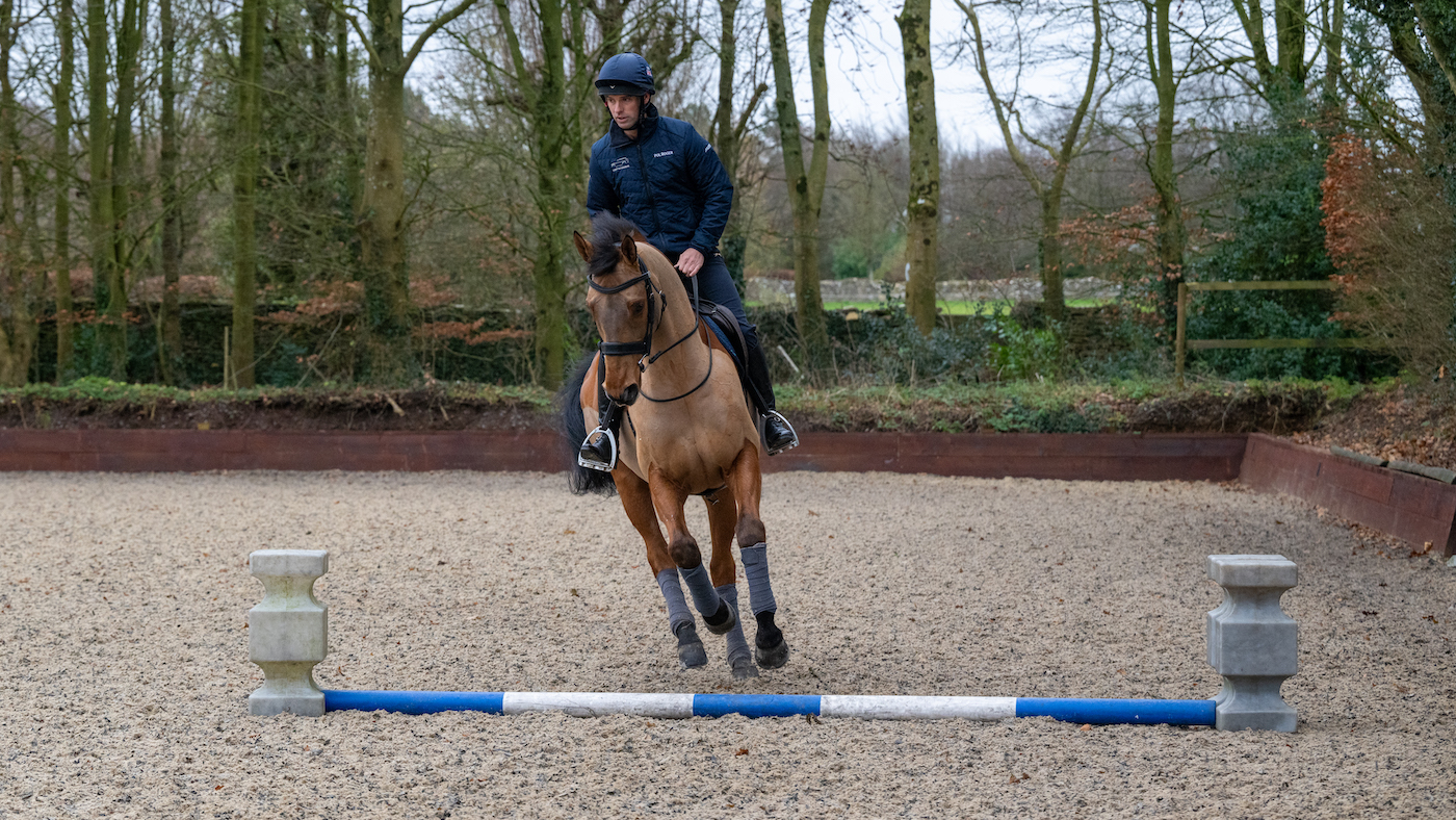 Harry Meade cantering a polework exercise on Superstition
