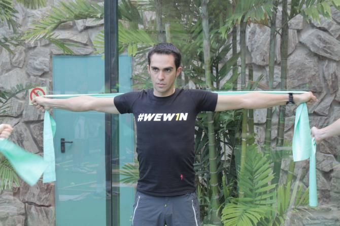 Alberto Contador stretches with his Tinkoff-Saxo teammates.