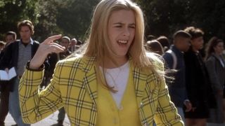 Cher looking disgusted in her yellow outfit in Clueless