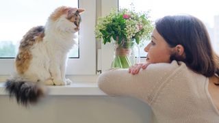 Lady talking to her cat