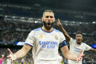 Karim Benzema celebrates after scoring Real Madrid's third goal against Real Madrid in the 2022 Champions League semi-final second leg at the Santiago Bernabeu.