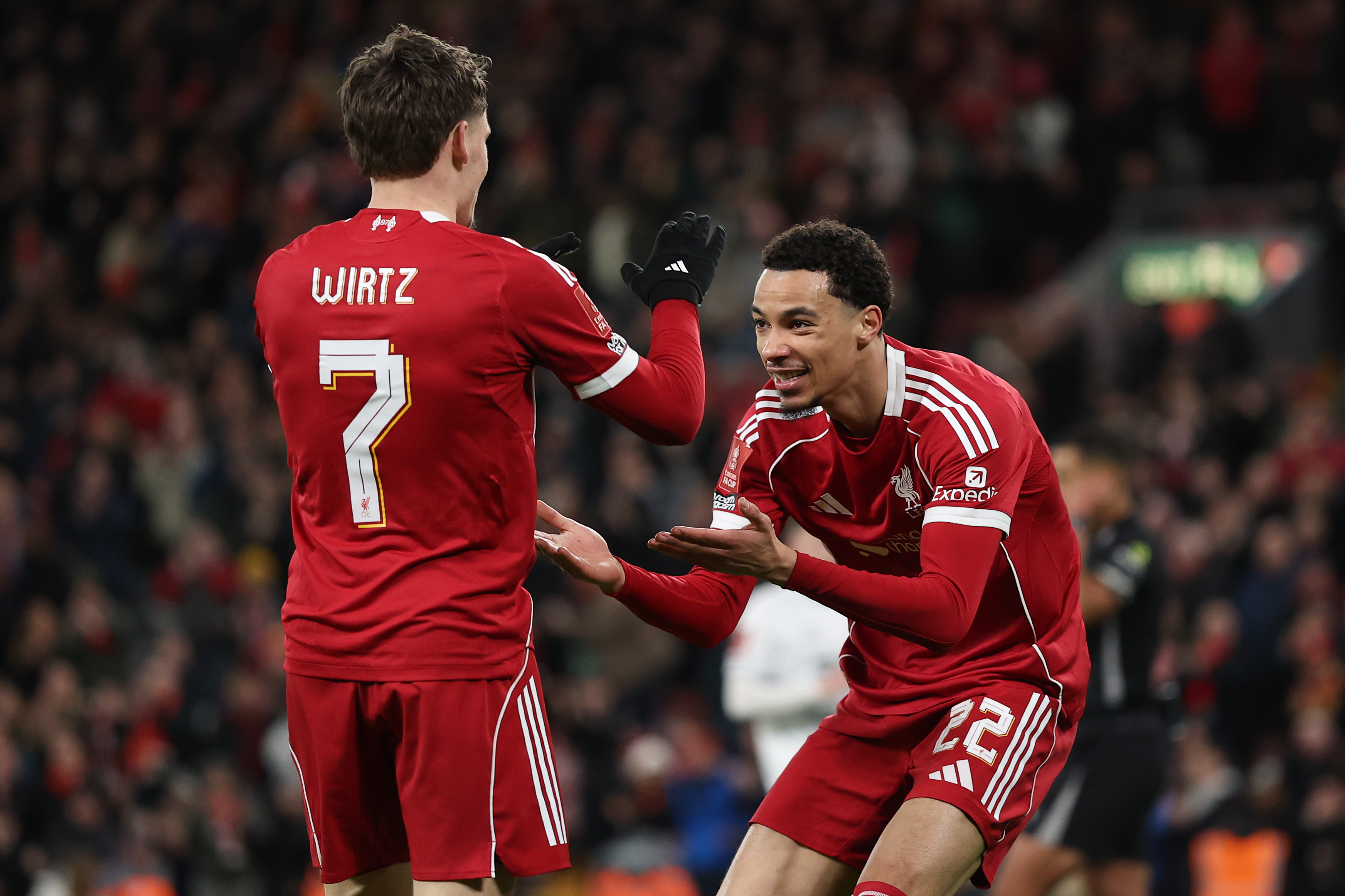 LIVERPOOL, ENGLAND - JANUARY 12: Hugo Ekitike of Liverpool celebrates scoring a goal with team mate Florian Wirtz during the Emirates FA Cup Third Round match between Liverpool and Barnsley on January 12, 2026 in Liverpool, England. (Photo by Jan Kruger/Getty Images)