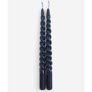 two navy twisted taper candles