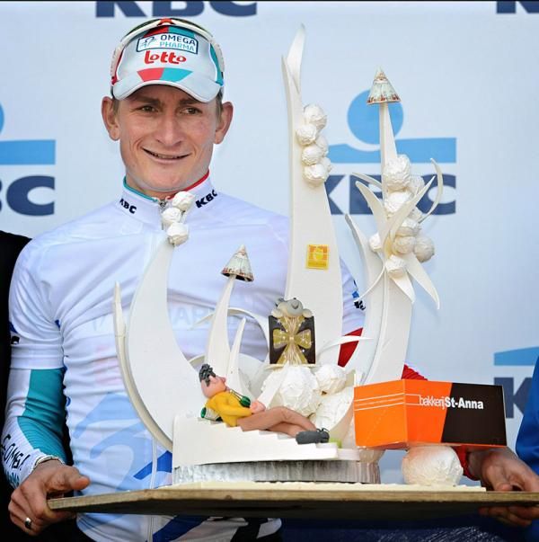 Race leader Andr&eacute; Greipel (Omega Pharma-Lotto) with a new trophy for his collection.