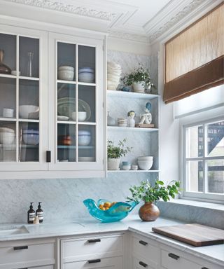 small white kitchen with grey veined marble