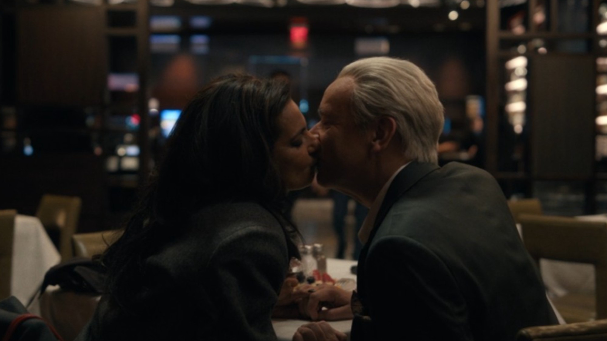 Poorna Jagannathan and Fred Armisen kissing in Deli Boys.