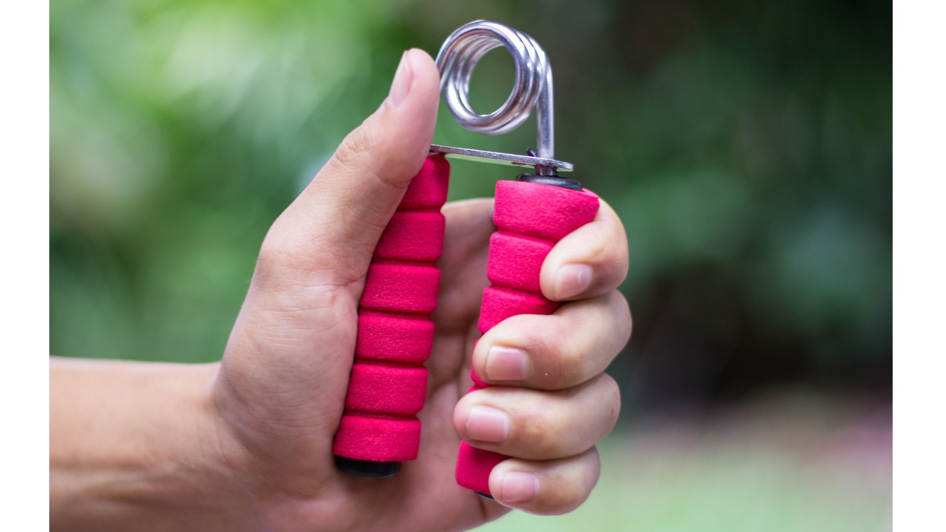 Woman's hand clutching a handgrip
