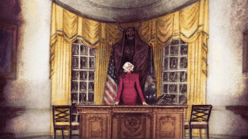 The President with a demon stood behind her in the Oval Office