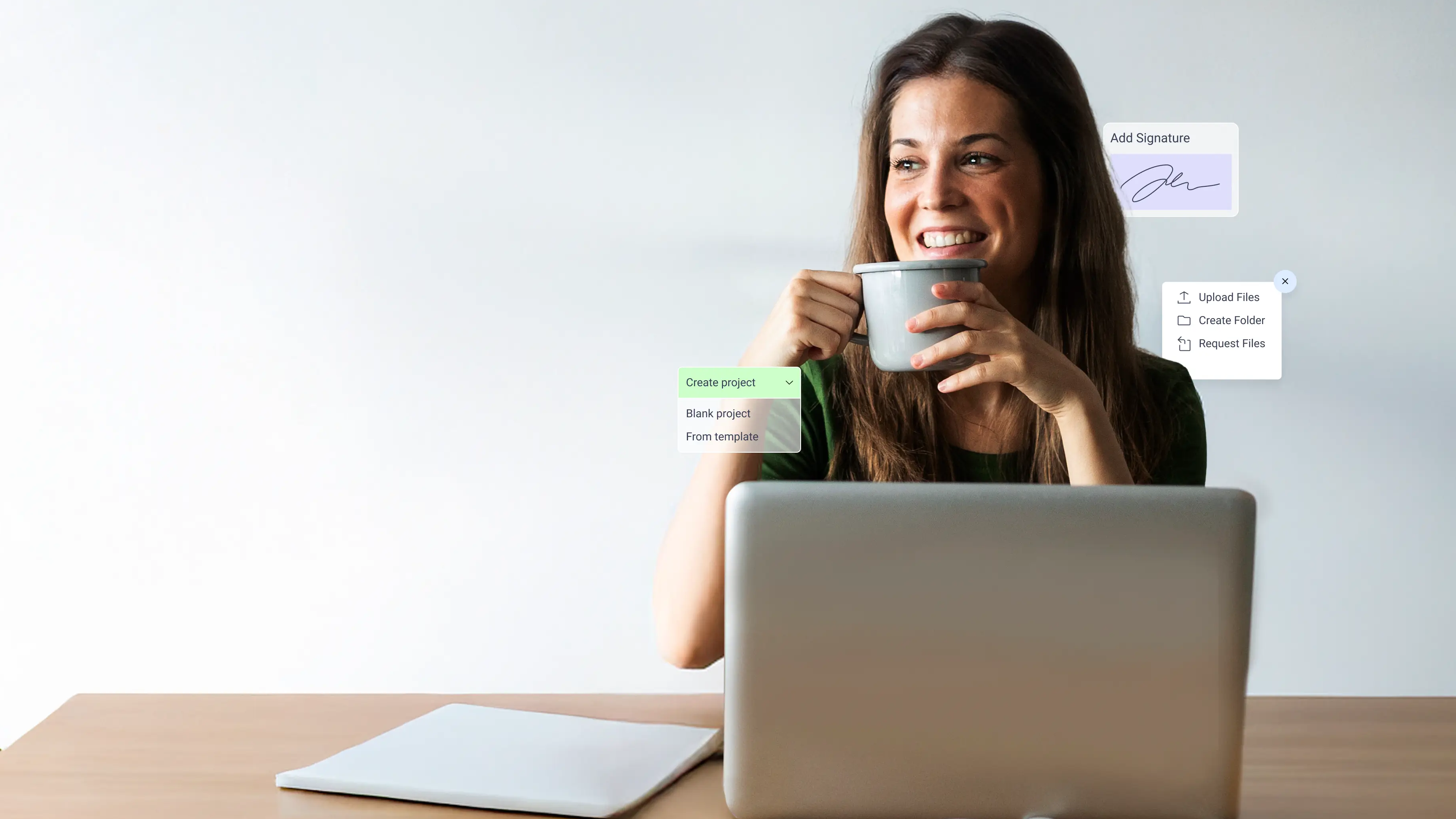A woman at a laptop with a coffee cup