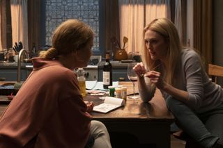 'The Woman In The Window': Jane (Julianne Moore) sits at the kitchen table showing Anna (Amy Adams) her locket